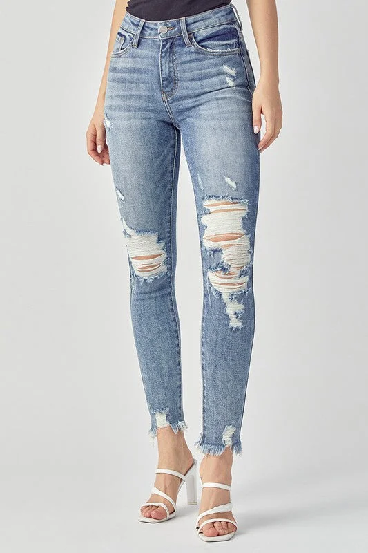 Risen Mid Rise Distressed Skinny Jeans